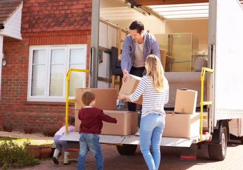 family-unpacking-moving-boxes-from-removal-truck_1218270-5702